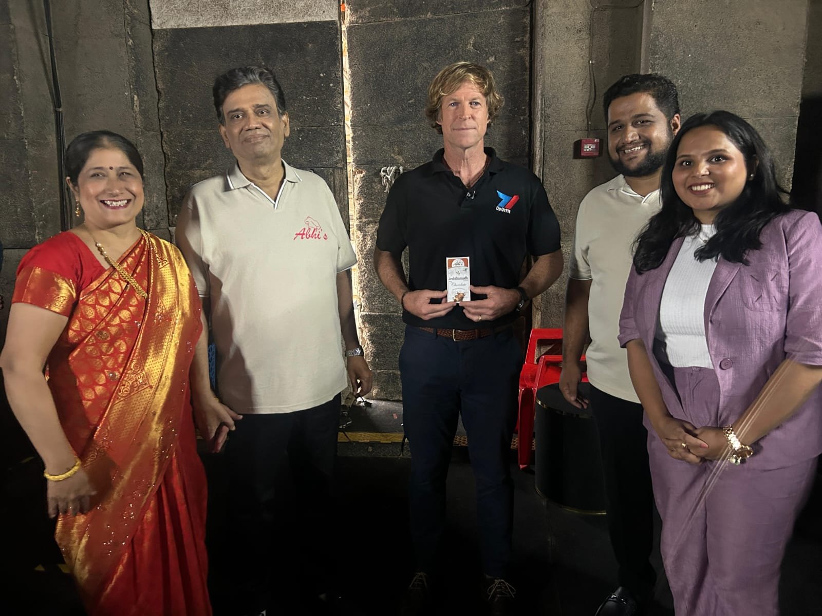 International Cricket Legend holding Seed & Silk Ayurvedic Chocolates